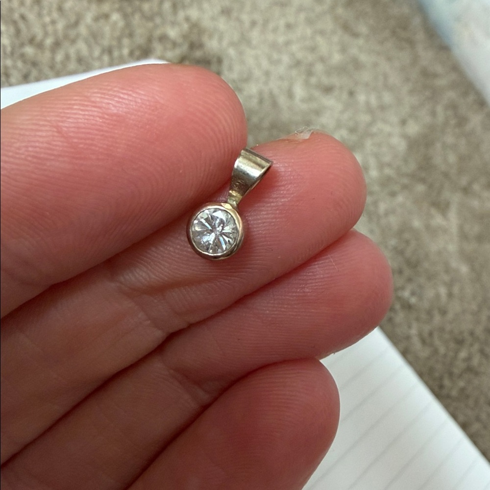 14K white gold round cut diamond bezel set pendant